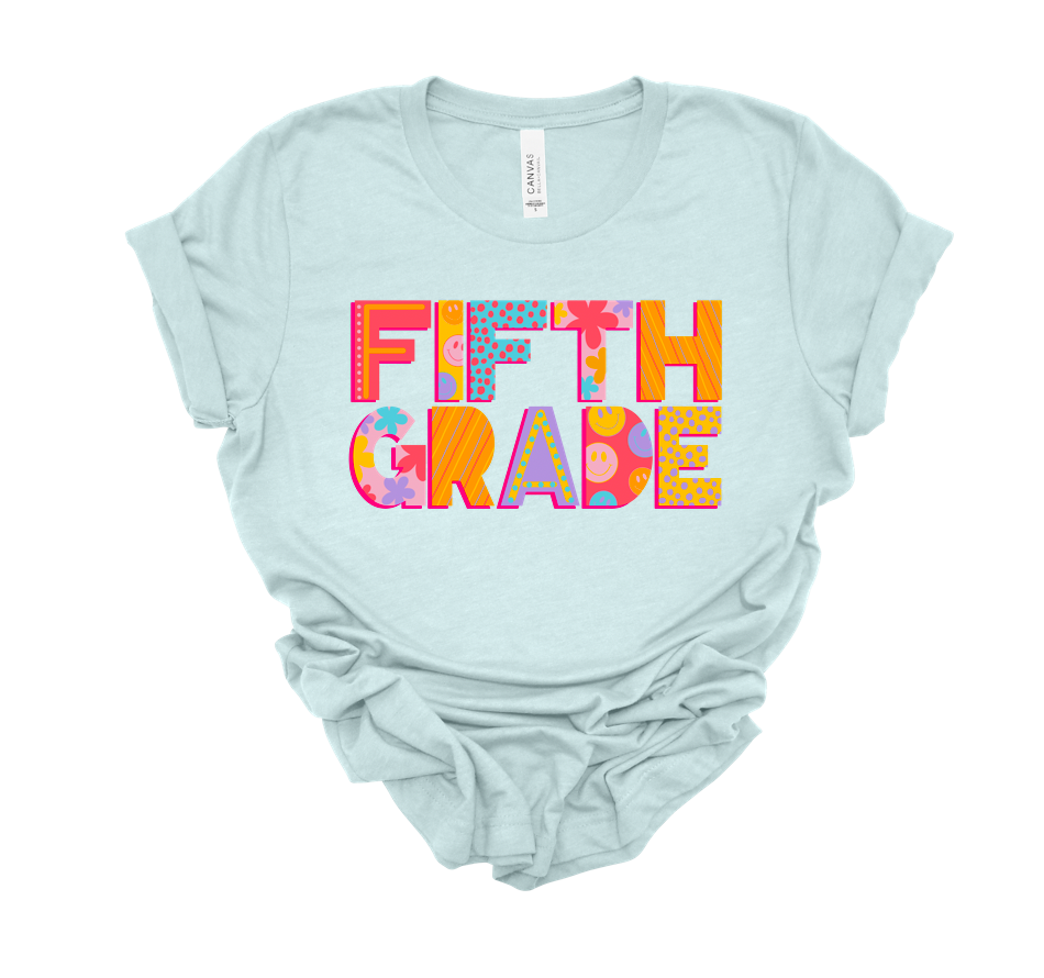 spotty smiley grade level tee | heather ice blue